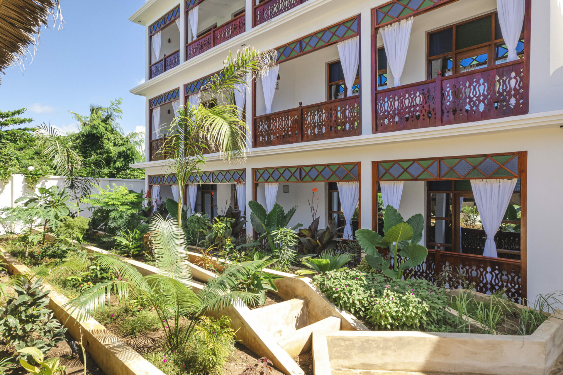 View of multiple rooms with a garden view at Tasneem Hotel, Zanzibar