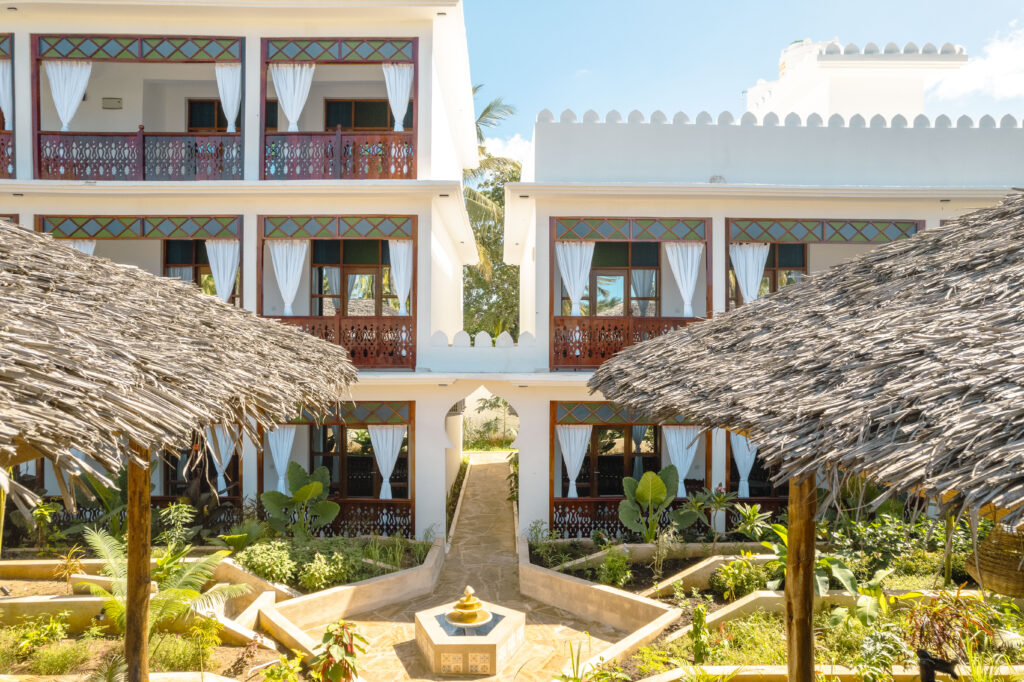 Beautiful garden courtyard with a fountain and balconies at Tasneem Hotel, Jambiani, Zanzibar