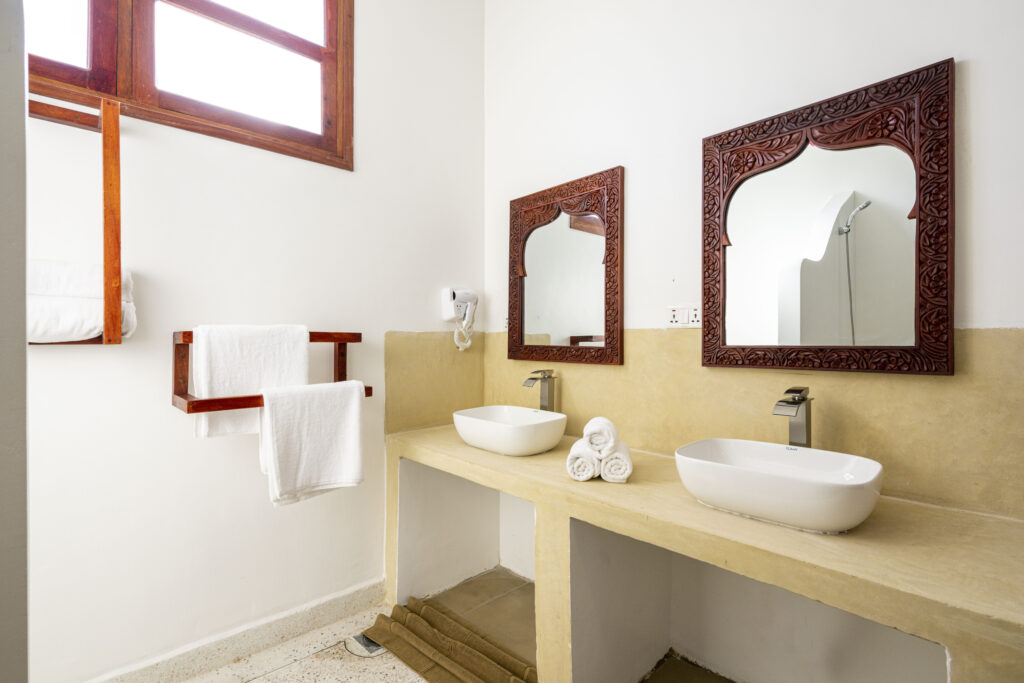 Modern bathroom featuring dual sinks at Tasneem Hotel Zanzibar