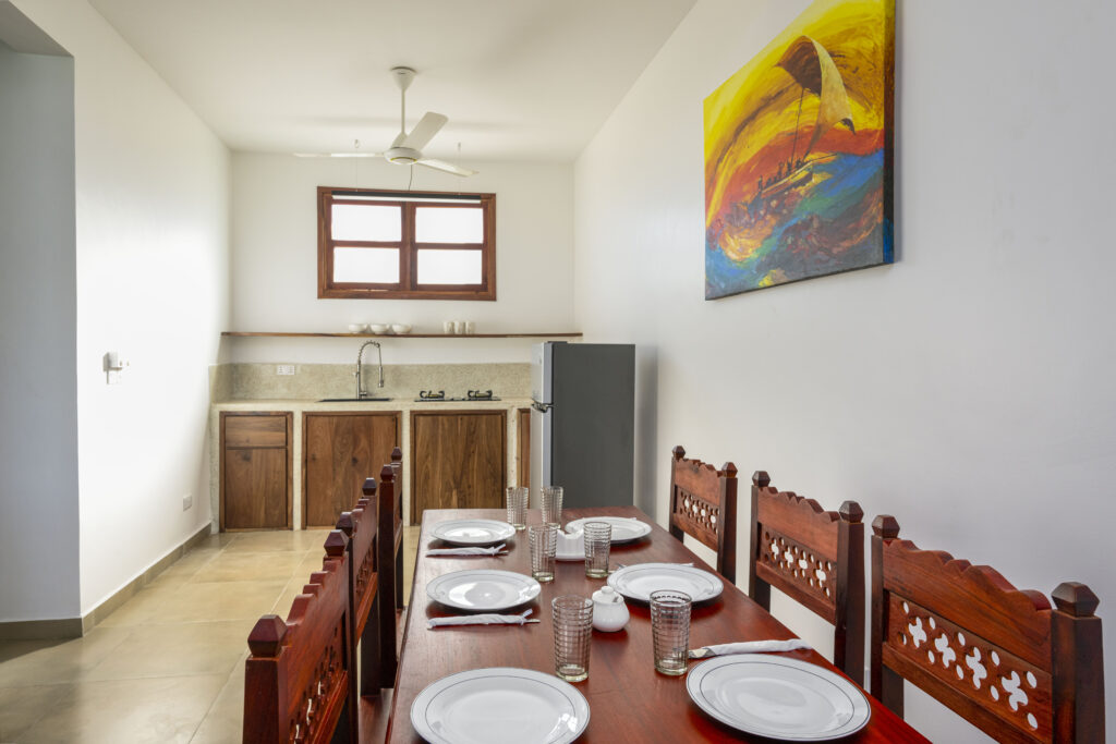 Kitchen with modern dining area at Tasneem Hotel Zanzibar, providing a cozy and functional space for guests